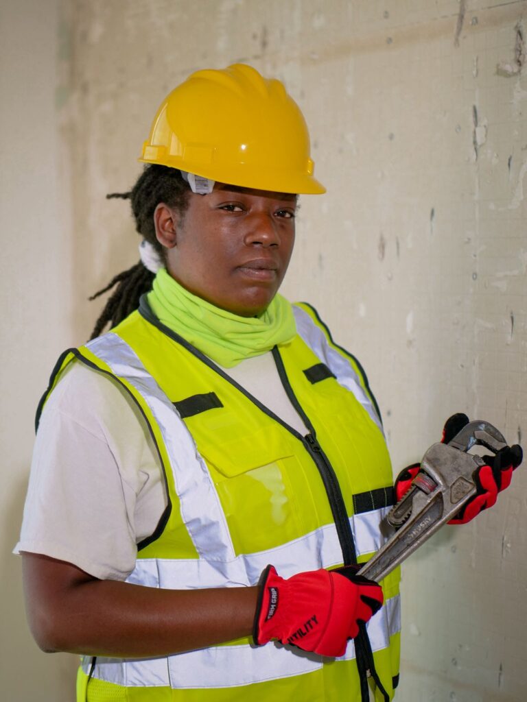 Licensed professional plumber holding a wrench