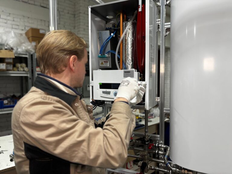 Technician repairing a residential water heater